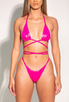 A model wearing the high cut Beach Cire III Metallic Pink Bikini Top